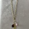 Collana con foglia , pon pon e cristallo - immagine 2